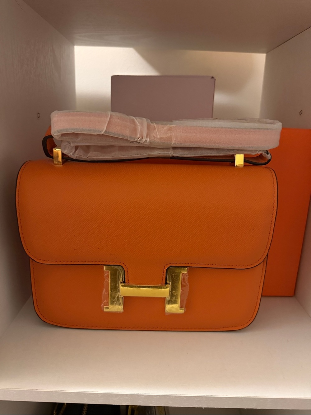 Elegant Orange Shoulder Bag with Gold H-Wrap Accent